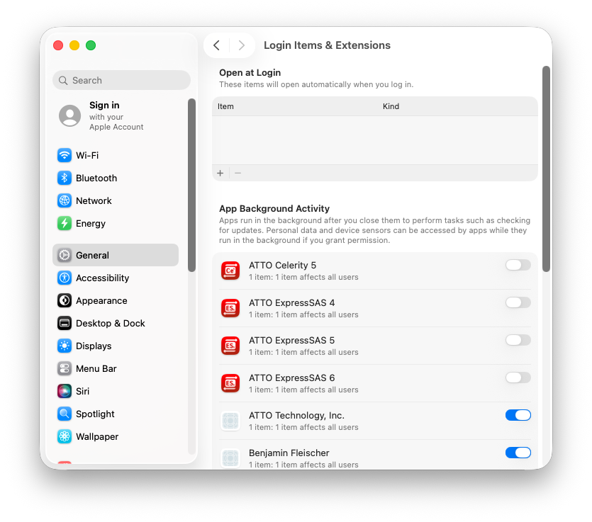 System Settings Login Items and Extensions in By App view, with ATTO ExpressSAS 5 listed as a Driver Extension